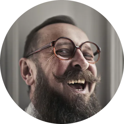 Daniel Gilchrist, laughing, with a sticky note on his forehead
