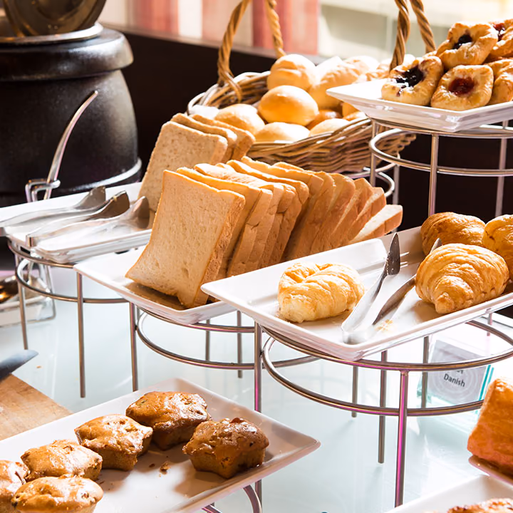 Tiered stands of bread, pastries and croissants