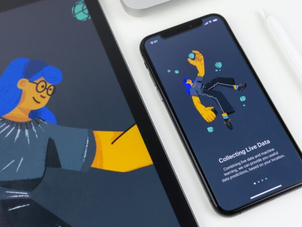 Illustrated onboarding screens on a tablet and phone