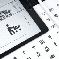 Riverline Transit wayfinding icons on a tablet and a printed sheet