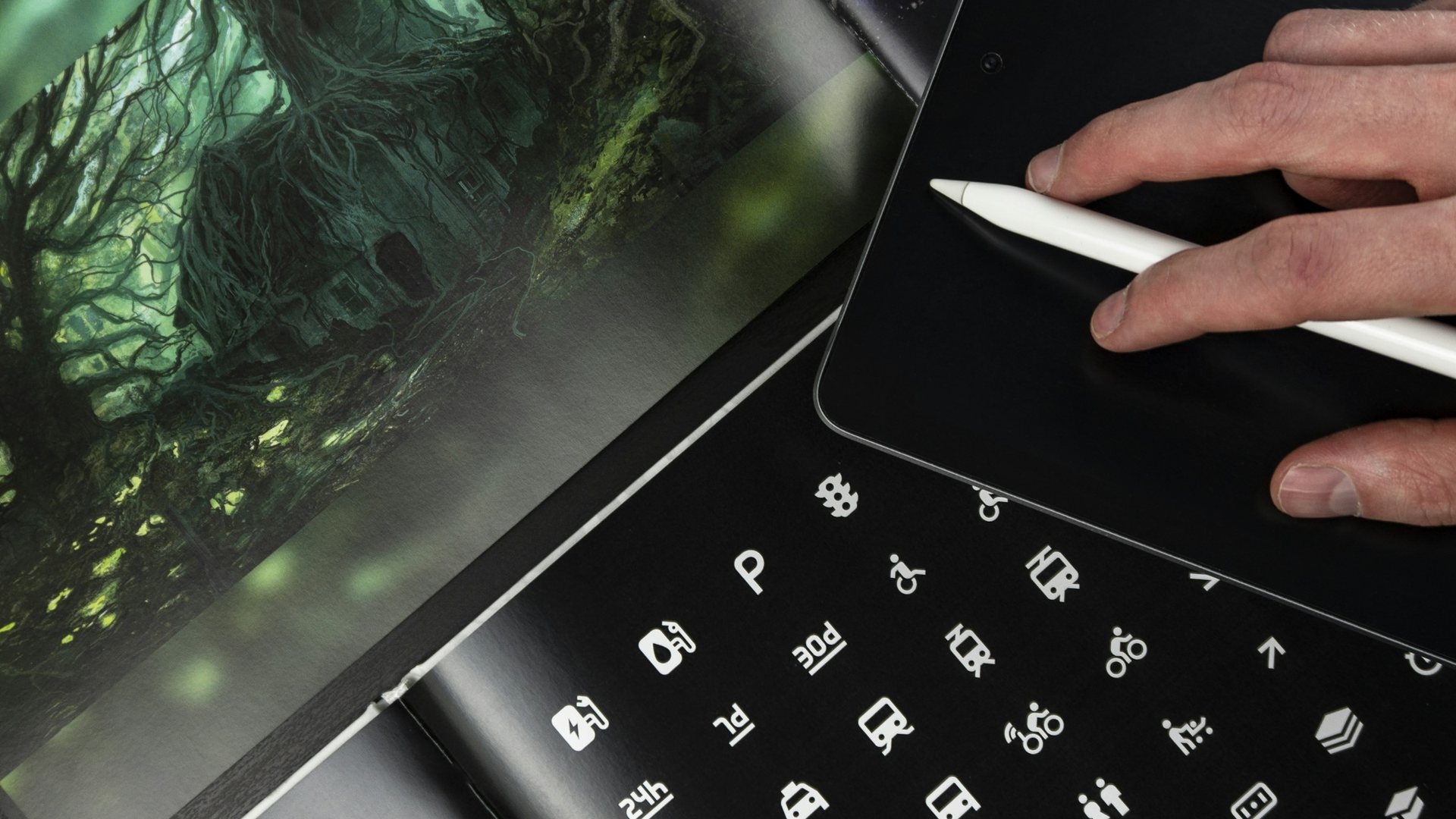 Designer sketching an icon set on a tablet