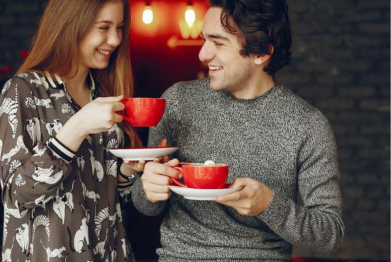 A couple is taking tea