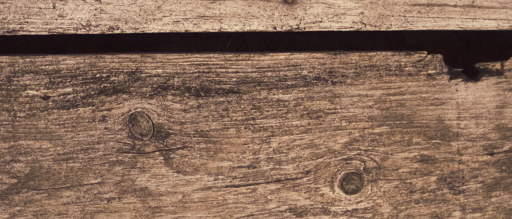 A close-up of warm brown plank grain