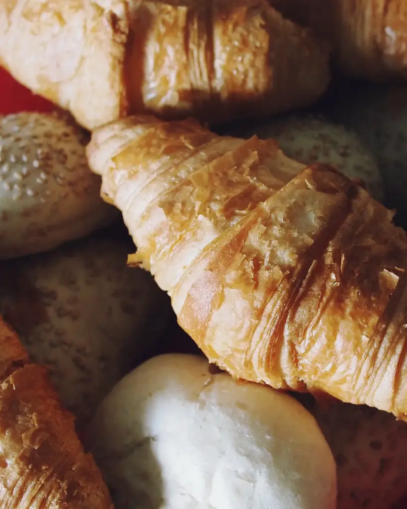 Croissants piled on a red cloth