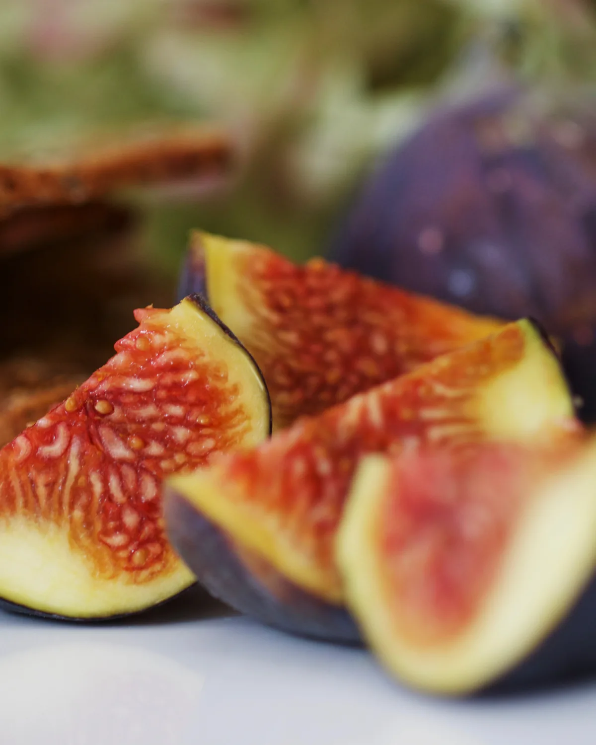 Figs cut in half, showing the pink inside