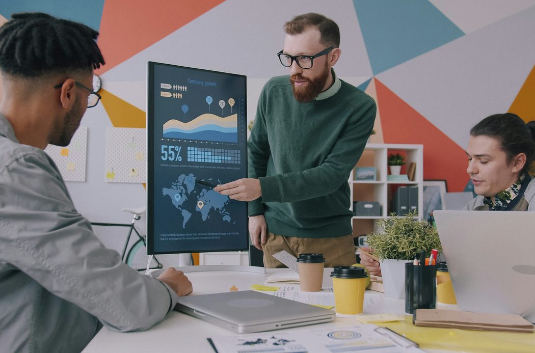 Northbank designers reviewing the Halden Rail identity on screen