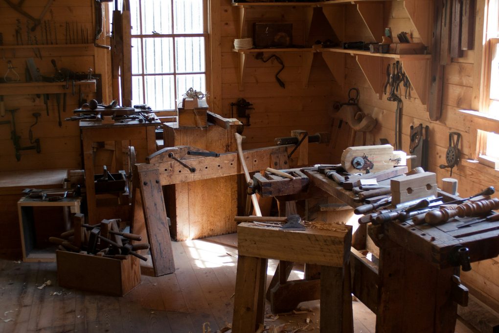 Sunlit workbenches, hand planes and chisels ready for an evening class in the Bright Lane woodwork room