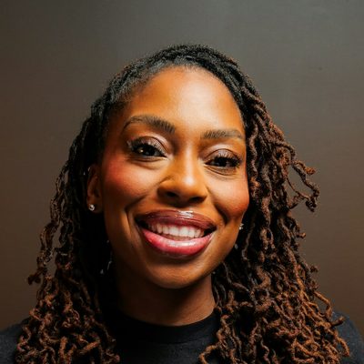Tess Oduya, principal engineer at Halden, smiling in a studio portrait