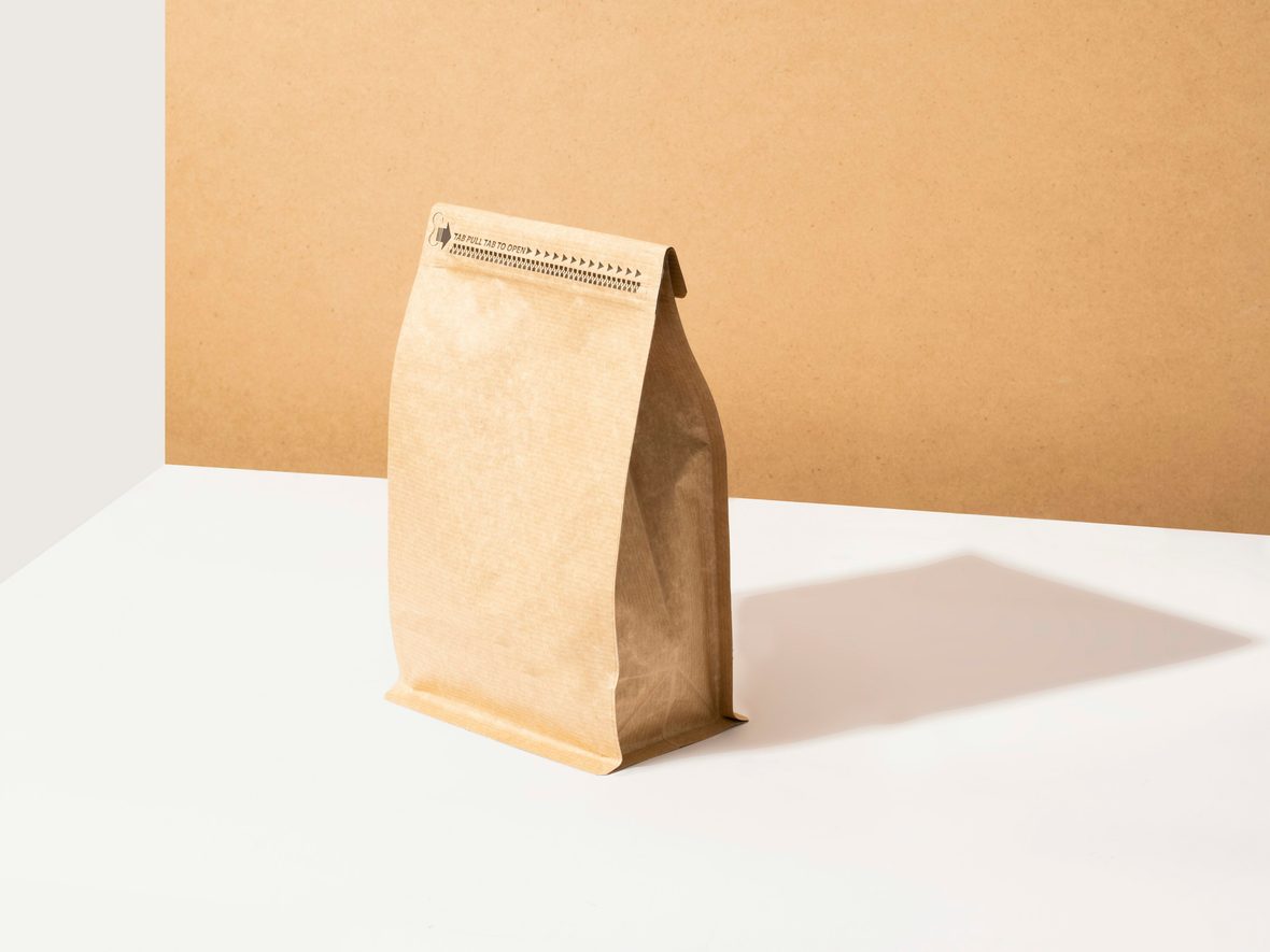 Nordwell Coffee packaging: a kraft paper coffee bag standing in soft studio light